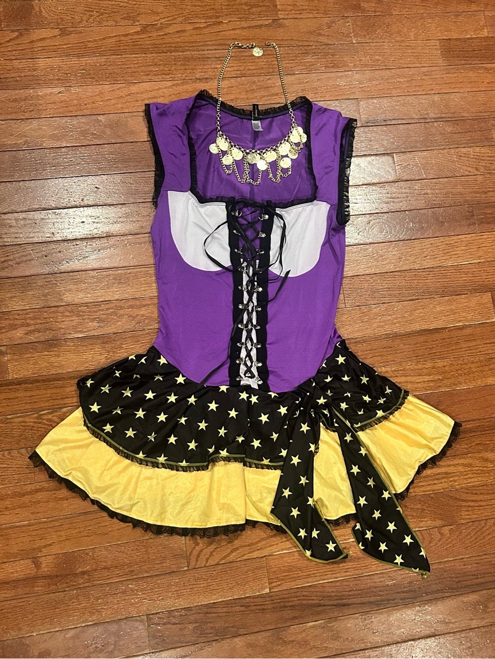 Forplay purple and yellow fortune teller costume with a star print skirt.